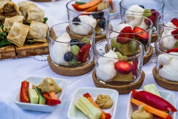 Elegant display of desserts and hors d'oeuvres featuring fresh fruits and pastry bites.
